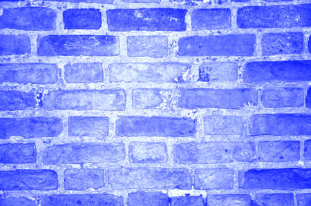 Classic blue trendy pastel monochromatic weathered brick wall background texture