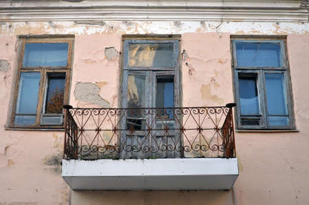 Balcony with a metal parapet on the facade of an old house. Architectureの写真素材