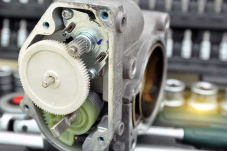 Repair and cleaning the car throttle. Analysis of the throttle on the background of a set of tools...