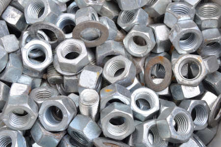 Nuts mounting large pallet. Texture, background. Industry, installation of products