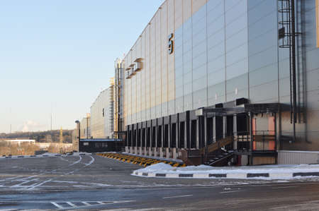 Front view of loading docks of a modern logistics center. Logistics