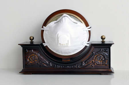 Home watch and a protective respirator with a valve. Prevent Coronavirus, COVID-19. Stay at home