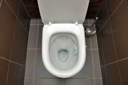 A white toilet with traces of rust from the flushing water. Hygiene Cleaningの写真素材