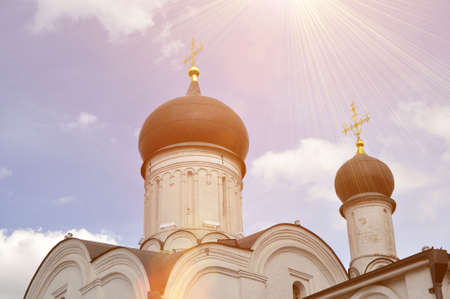 Domes of the Orthodox Church with crosses against the blue sky. Orthodox Russiaの写真素材