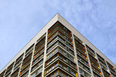 Glass multicolored square windows of the facade of a skyscraper of a modern city business building....