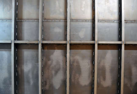 The wall of a welded metal container. Background, texture.の写真素材