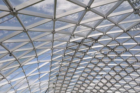 Modern pavilion roof made of glass and metal. Construction.