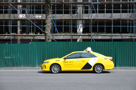 Moscow, Russia - May 30, 2021: Yandex taxi on the city streets. The best taxi in Russia for quality and priceのeditorial素材