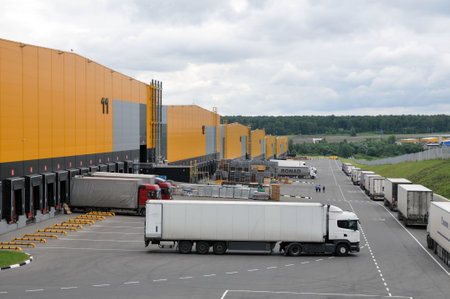 Moscow, Russia - July 4, 2021: Work of the warehouse logistics center. The truck pulls up to load.