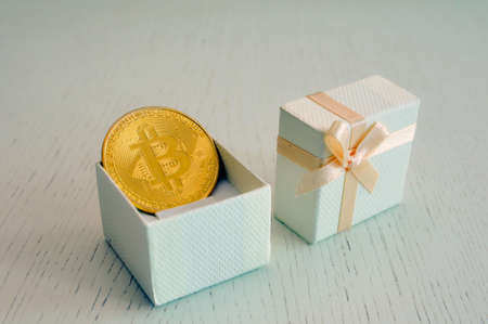 Gift box with bitcoin symbol, gift concept.の写真素材