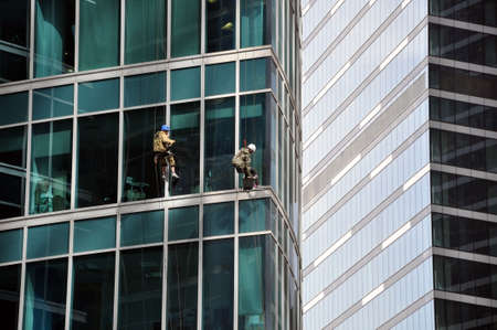 MOSCOW / RUSSIA - MAY 28, 2018: Industrial climbers wash the windows of the Moscow-City business centerのeditorial素材