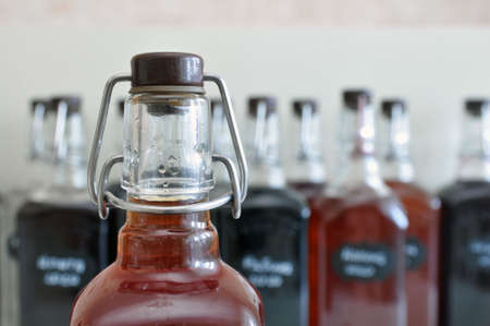 drag stopper on a bottle of moonshine. Home brewing.