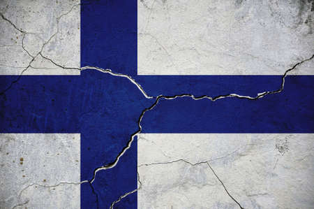 An image of the flag of Finland on a wall with a crack. Background.の写真素材