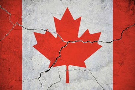 An image of the flag of Canada on a wall with a crack. Background.の写真素材