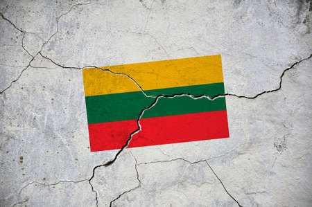 An old image of the flag of Lithuania on a wall with a crack. a crisis.の写真素材