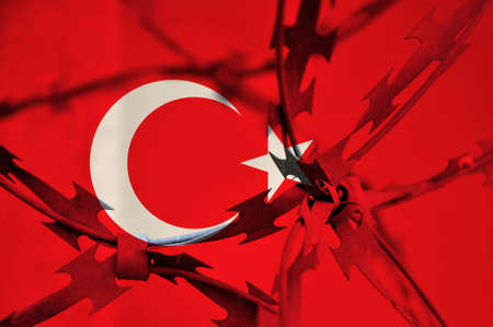 Abstract image of the national flag of Turkey with twisted barbed wire. Repression.の写真素材
