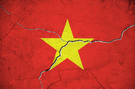 An image of the Vietnam flag on a wall with a crack. background.の写真素材