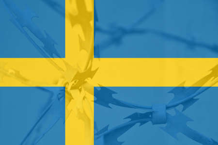 Abstract image of the national flag of Sweden with twisted barbed wire.の写真素材
