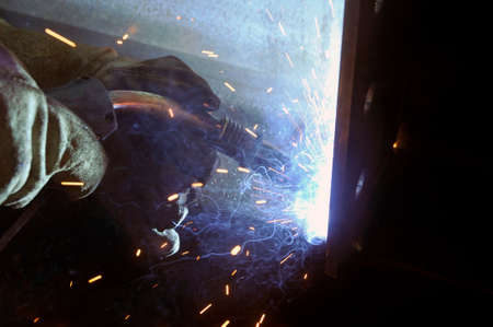 Welding arc. The process of welding products and metal. Manufacture of metal structures according to...