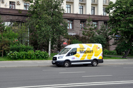 Moscow, Russia - June 26, 2022 - Yandex Market delivery van on the city streets. Cyrillic...