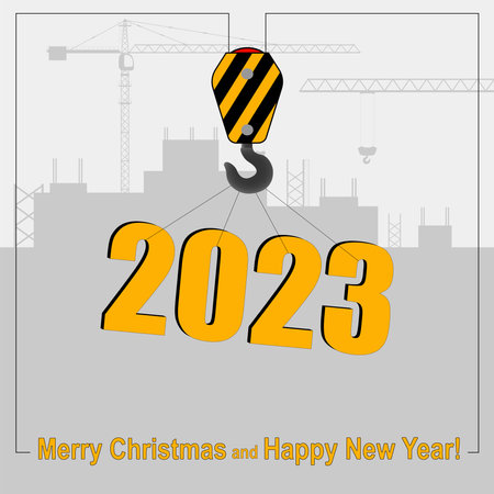 Happy New Year and Merry Christmas concept. A crane lifts the symbol of 2023 against the backdrop of...