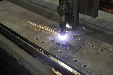 metal cutting processing. The process of cutting sheet metal on a CNC machine using plasma cutting....