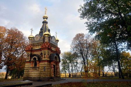 The chapel at the grave of the Paskevich family in Gomel against the backdrop of an autumn park on a cloudy rainy day.の写真素材