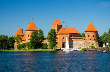 Medieval gothic Trakai Island Castle with stone walls and towers with red tiled roofs in Lake Galve, Lithuaniaのeditorial素材