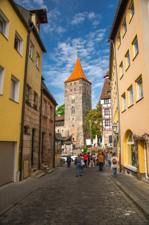 Old medieval Tower Tiergartnertorturm and traditional buildings on the streets of Nuremberg Nurnberg city, Mittelfranken region, Bavaria, Germanyのeditorial素材