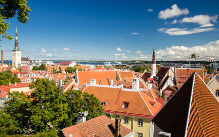 Panoramic view of Old Town of Tallinn with traditional red tile roofs, medieval churches, towers and walls, from Kohtuotsa Vaateplatvorm Toompea Hill, Estoniaの写真素材
