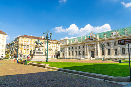 Biblioteca Nazionale National Library rococo style building on Piazza Carlo Alberto square with green lawn in historical centre of Turin Torino city with blue sky background, Piedmont, Italyのeditorial素材