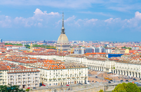 Aerial top panoramic view of Turin city center skyline with Piazza Vittorio Veneto square, Po river and Mole Antonelliana building with high spire, blue sky white clouds background, Piedmont, Italyの写真素材