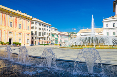 Piazza Raffaele De Ferrari square with fountain, Palazzo Ducale Doge's Palace and Teatro Carlo Felice theatre building in historical centre of old city Genoa (Genova) with blue sky, Liguria, Italyのeditorial素材