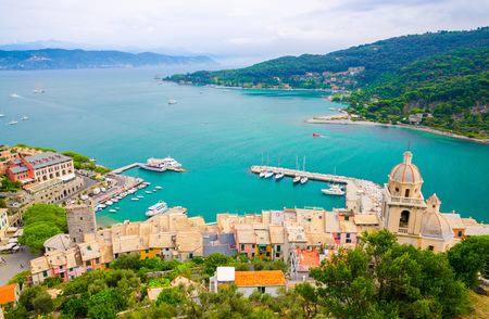 Top aerial view of Gulf of Spezia turquoise water, dome of Chiesa di San Lorenzo church, port marine of Portovenere town, Palmaria island, Ligurian sea, Riviera di Levante, La Spezia, Liguria, Italyの写真素材