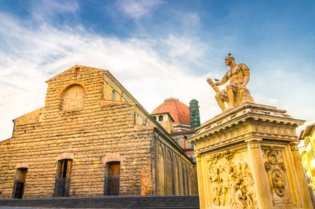 Basilica di San Lorenzo Cappelle Medicee chapel and Giovanni delle Bande Nere monument on Piazza di San Lorenzo square in historical centre of Florence city, blue sky white clouds, Tuscany, Italyの写真素材