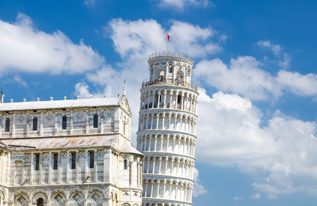 Pisa Cathedral Duomo Cattedrale and Leaning Tower Torre on Piazza del Miracoli square, blue sky with white clouds background in sunny day, Tuscany, Italyの写真素材