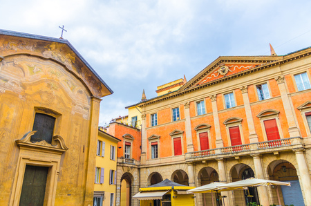 Palazzo Manzoli Malvasia palace facade and Chiesa di San Donato church building in old historical...