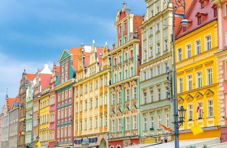 Row of colorful buildings with multicolored traditional facades on Rynek Market Square in old historical city centre of Wroclaw, Polandの写真素材