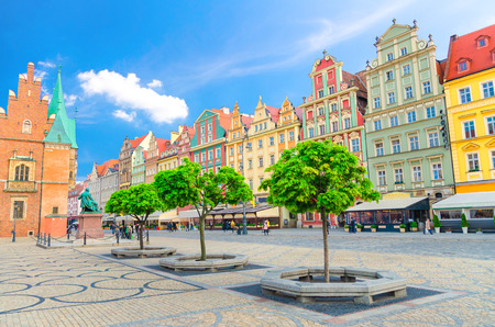 Row of colorful buildings with multicolored facade and Old Town Hall building on cobblestone Rynek Market Square in old town historical city centre of Wroclaw, Polandのeditorial素材