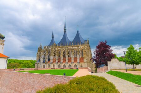 Saint Barbara's Church (Cathedral of St Barbara) Roman Catholic church Gothic style building in Kutna Hora historical Town Centre, blue dramatic sky background, Central Bohemian Region, Czech Republicの写真素材