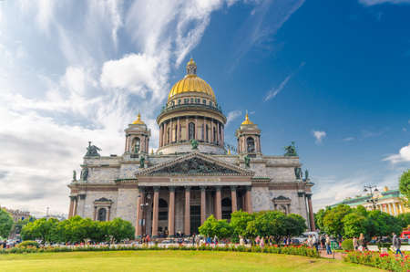 Saint Isaac's Cathedral or Isaakievskiy Sobor museum, neoclassical style building with golden dome, Russian Orthodox Church, blue sky white clouds, green lawn, Saint Petersburg Leningrad city, Russiaのeditorial素材