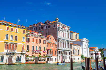 The Palazzo Flangini is a Baroque style palace building and Campo San Geremia Roman Catholic church on the Grand Canal waterway with boat in Cannaregio sestiere, Venice, Veneto Region, Northern Italyのeditorial素材