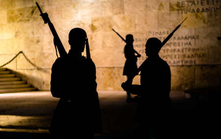 Athens, Greece - May 11, 2016: Figure silhouette of guards Evzones at night in front of the Monument of the Unknown Soldier near the Greek parliament in Athens, Greeceのeditorial素材
