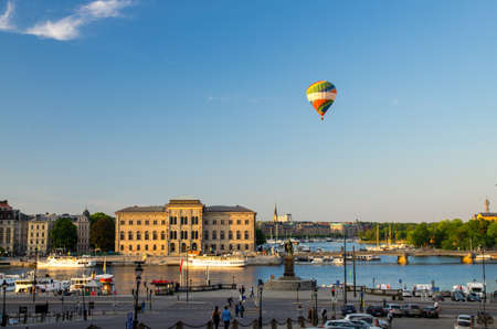 Sweden, Stockholm, May 29, 2018: National Museum of Fine Arts Nationalmuseum building on peninsula Blasieholmen in city centre with colorful balloon in blue sky view from old town quarter Gamla Stanのeditorial素材