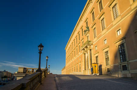 Sweden, Stockholm, May 30, 2018: Guard soldier at post near central enter Royal Palace northern facade Kungliga slottet in historical centre Gamla Stan Old Town (official residence of Swedish monarch)のeditorial素材