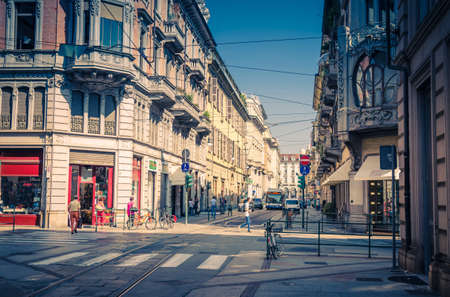 Turin, Italy, September 10, 2018: People are walking down the streets with old Neoclassicism style buildings with balconies in beautiful summer day, Piedmontのeditorial素材