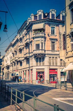 Turin, Italy, September 10, 2018: People are walking down the streets with old Neoclassicism style buildings with balconies in beautiful summer day, Piedmontのeditorial素材