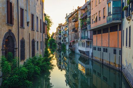 Ponte delle Torricelle bridge across canal with buildings on sides in historical city centre of Padua, evening twilight view, Padova town, Veneto Region, Italyの写真素材