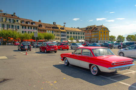 Vevey, Switzerland - September 14, 2016: Parking with colourful cars and buildings near the Lake Leman (Lake Geneva) in Vevey, Swiss Riviera, Switzerlandのeditorial素材