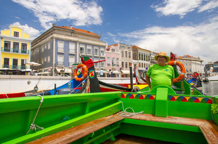 Aveiro, Portugal - June 13, 2017: Boatman on Moliceiro tradtional boat gondola on the Aveiro Riverのeditorial素材